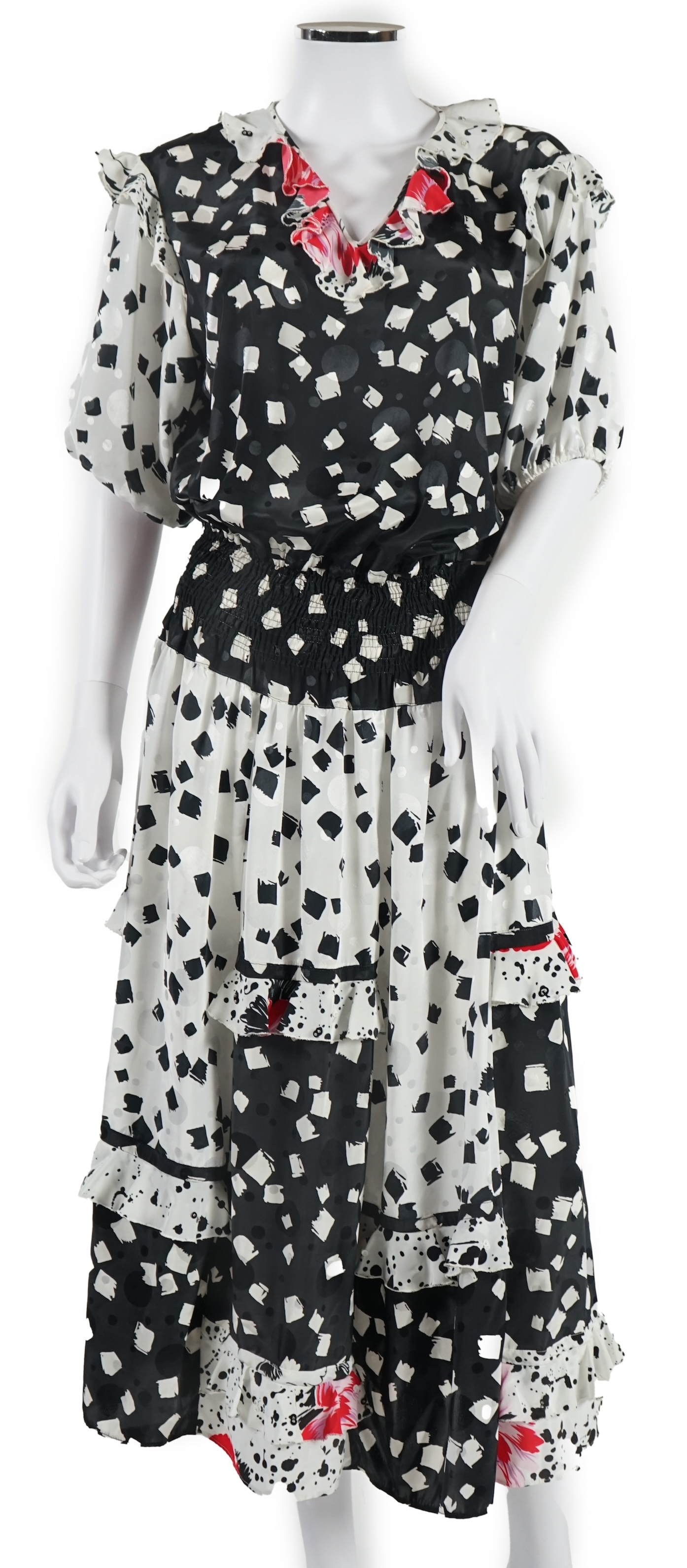 Three multi coloured dresses, no labels. Approx size 10-12 Proceeds to Happy Paws Puppy Rescue